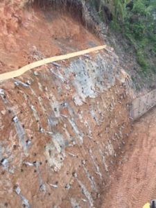 View of the anchors installed and shotcreted into place to stabalise the 11m high earth wall.