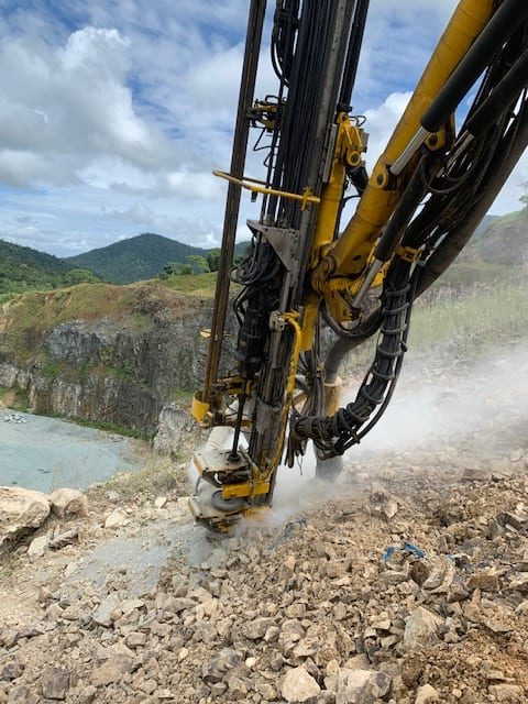 Close-up view of drilling operations on the cliff edge at Gregory Quarry.