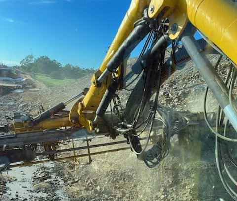 Close up of drill rig performing sub-horizontal drain drilling for the Walkerston Bypass Project.