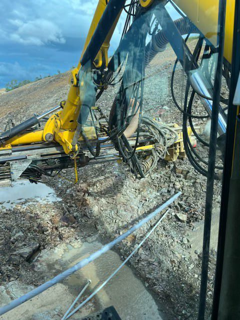 View from above of D7 Atlas Copco Drill Rig executing sub-horizontal drain installation for the Walkerston Bypass Project.