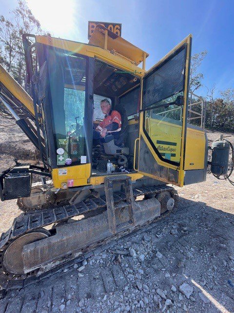 Peter operating an Atlas Copco drill rig on the Kaban Windfarm project